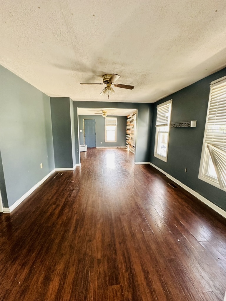 411 East Hamilton Street Odell, IL 60460 - Photo 7 of 19 a view of livingroom with hardwood floor and window