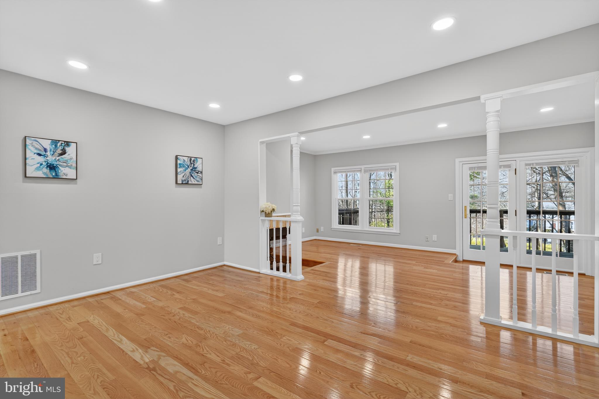8868 Winding Hollow Way Springfield, VA 22152 - Photo 12 of 53 a view of empty room with wooden floor and fan