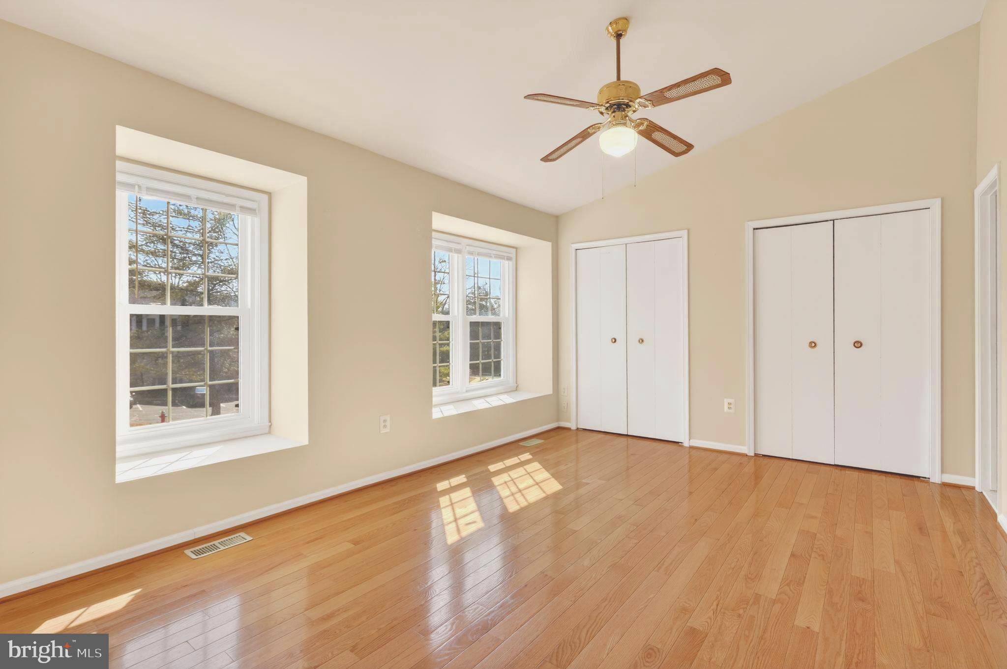 8868 Winding Hollow Way Springfield, VA 22152 - Photo 23 of 53 wooden floor in an empty room with a window