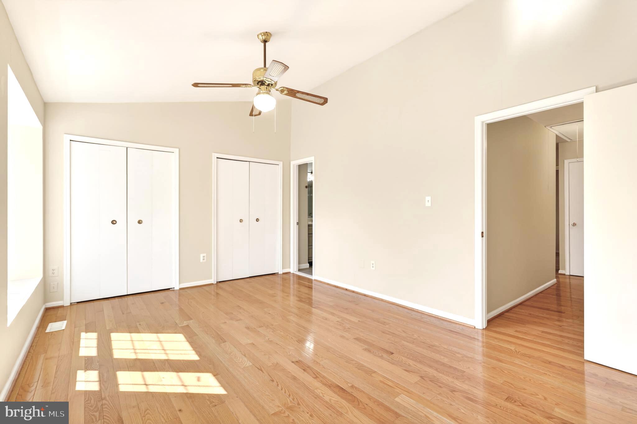 8868 Winding Hollow Way Springfield, VA 22152 - Photo 25 of 53 a view of an empty room with wooden floor