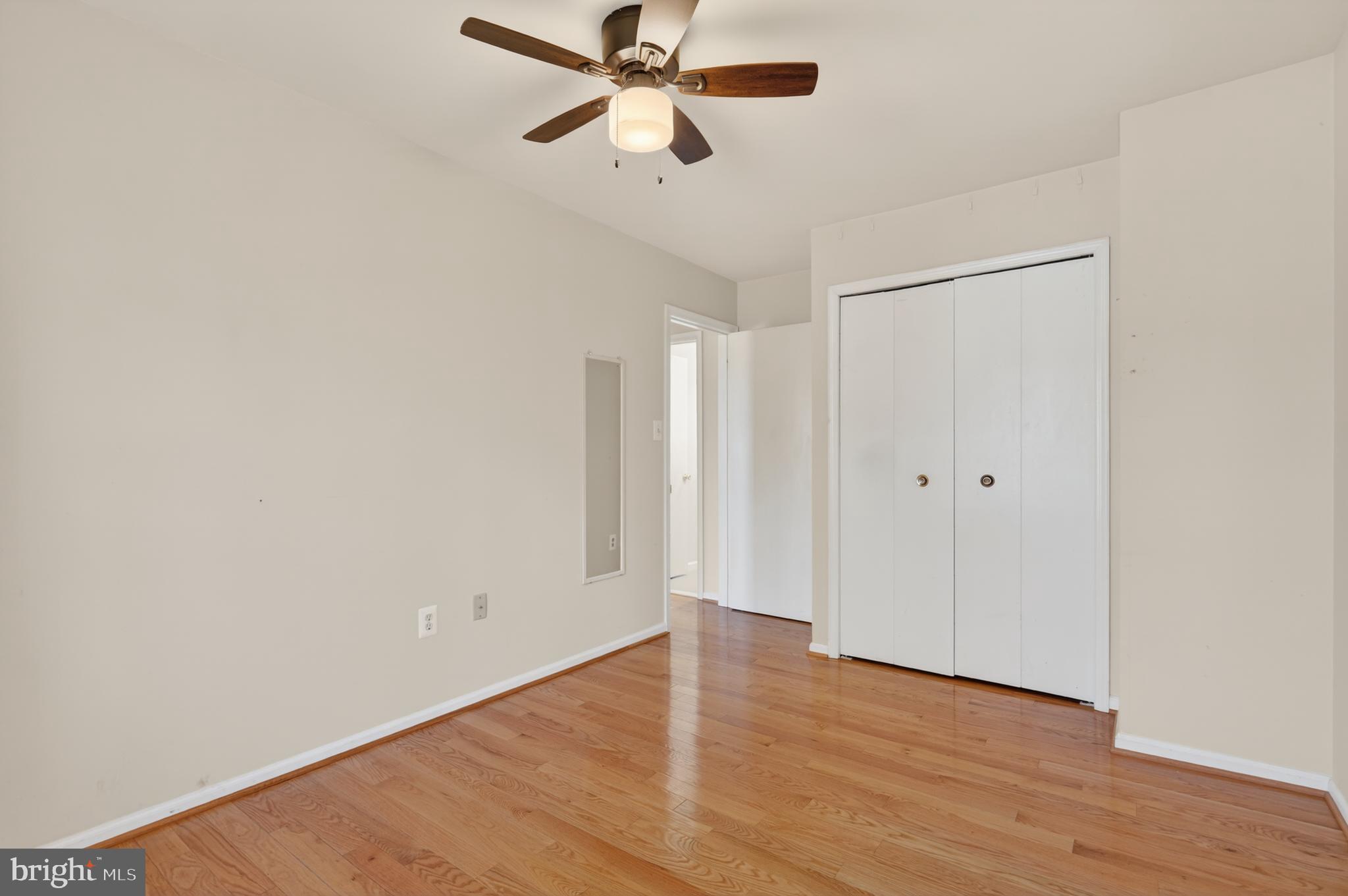 8868 Winding Hollow Way Springfield, VA 22152 - Photo 30 of 53 a view of empty room with wooden floor