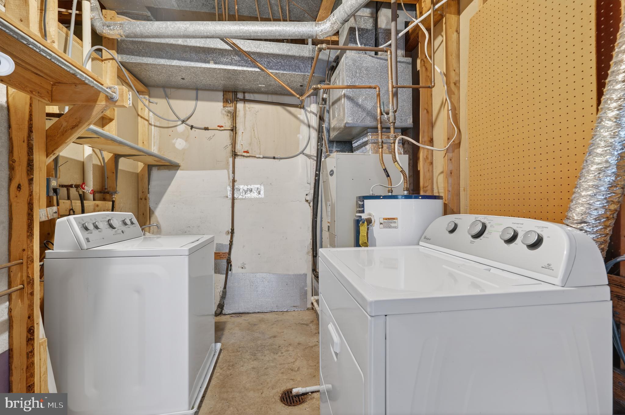 8868 Winding Hollow Way Springfield, VA 22152 - Photo 42 of 53 a utility room with dryer and washer