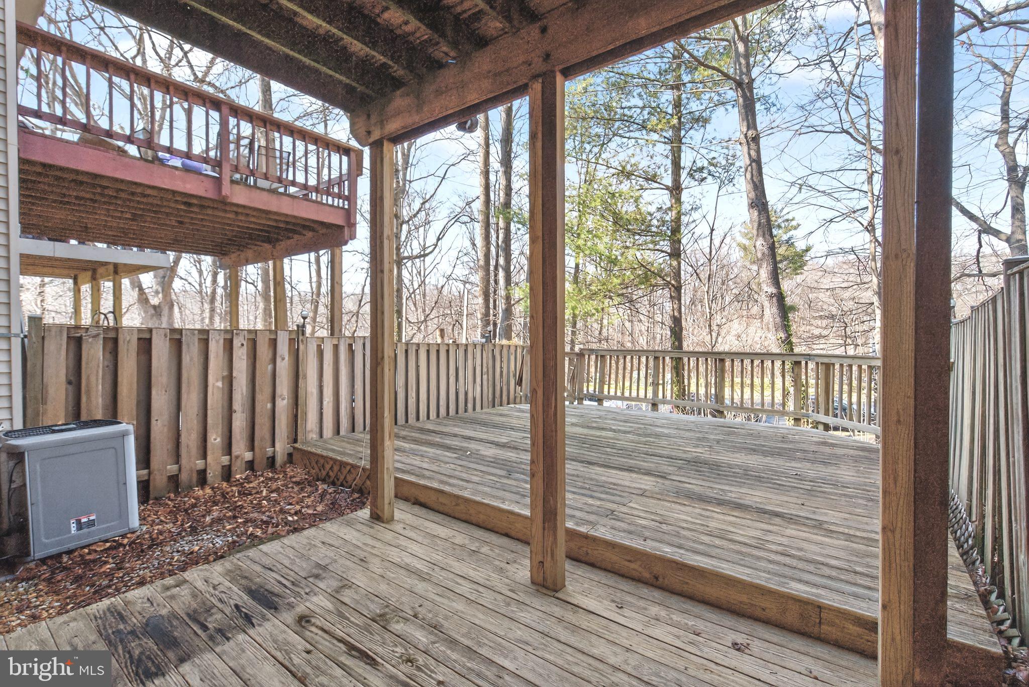 8868 Winding Hollow Way Springfield, VA 22152 - Photo 44 of 53 a view of a room with wooden floor and wooden floor