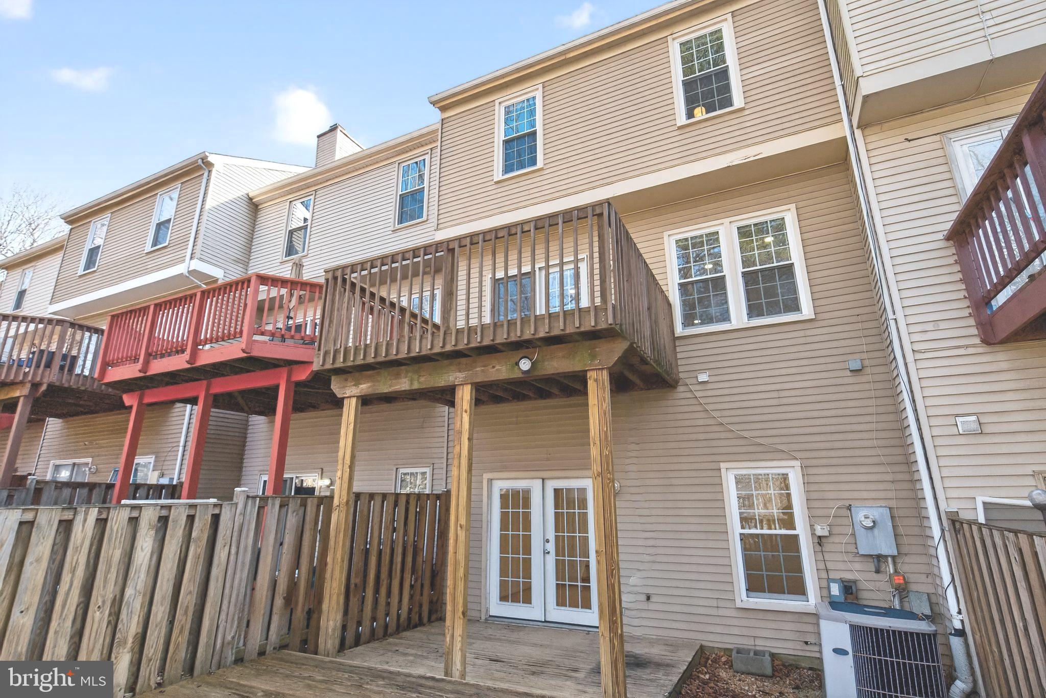 8868 Winding Hollow Way Springfield, VA 22152 - Photo 46 of 53 a front view of a house with a balcony