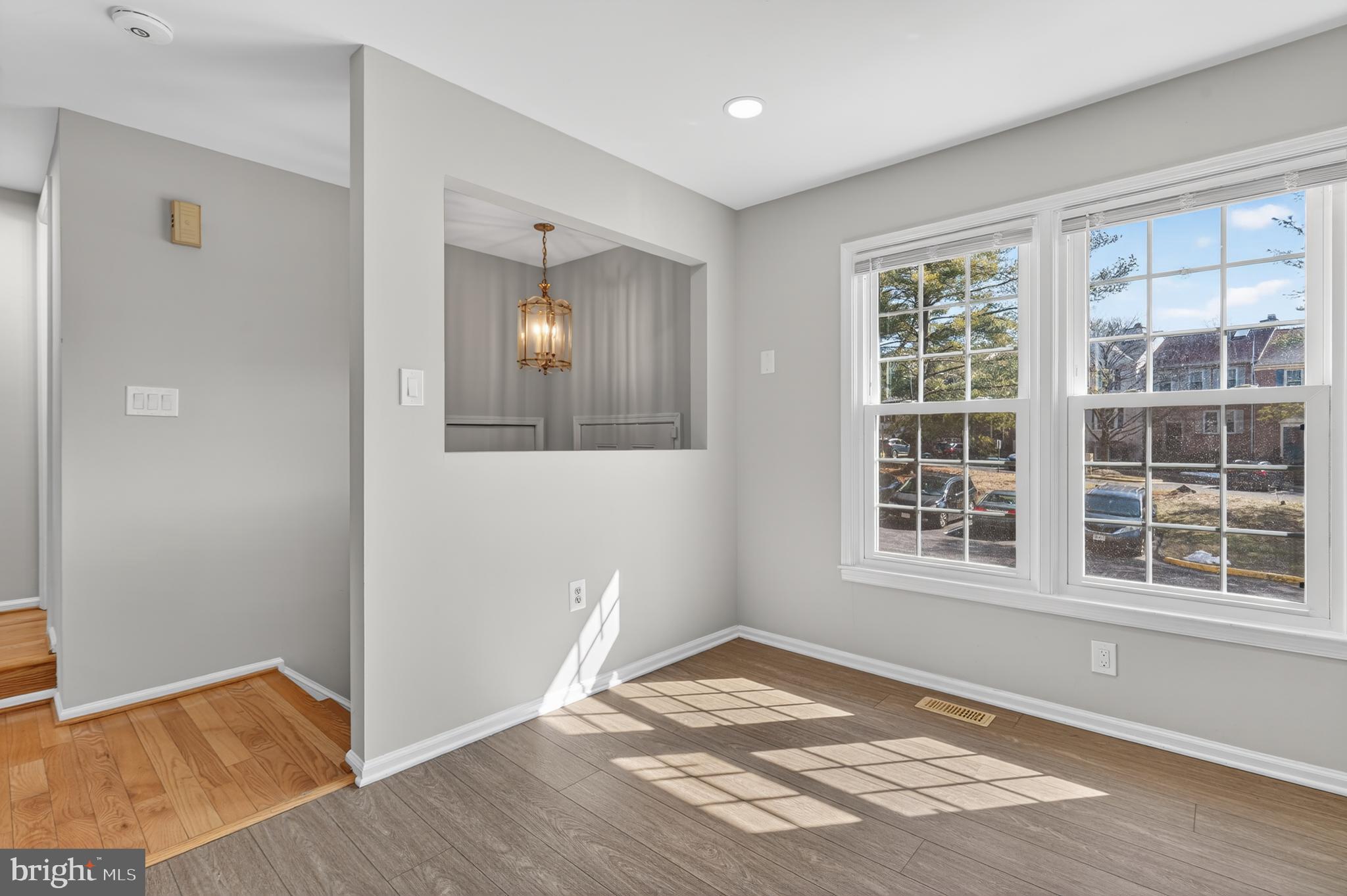8868 Winding Hollow Way Springfield, VA 22152 - Photo 6 of 53 a view of empty room with wooden floor and fan
