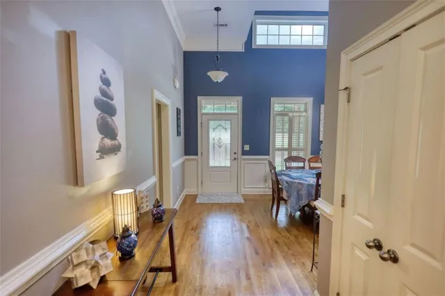 a view of a livingroom with furniture window and wooden floor