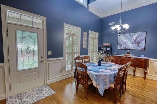 a kitchen with stainless steel appliances granite countertop a refrigerator a stove and a sink with cabinets