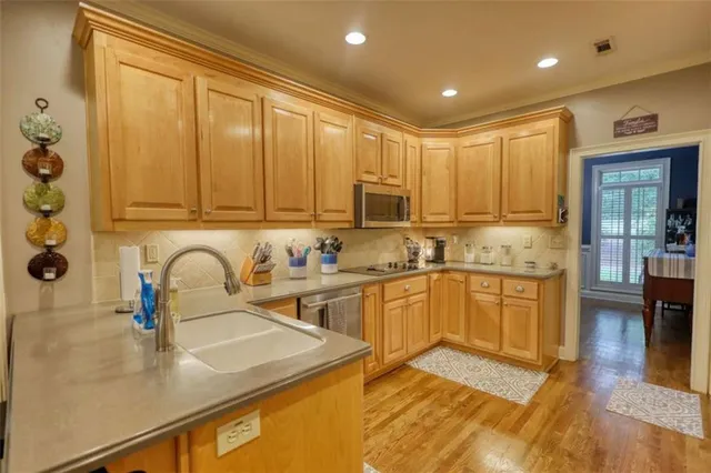 a living room with furniture a ceiling fan and a rug