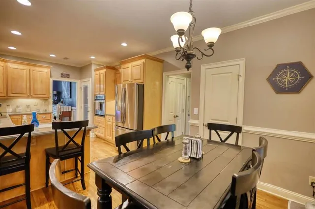 a kitchen with stainless steel appliances granite countertop a sink a stove and cabinets