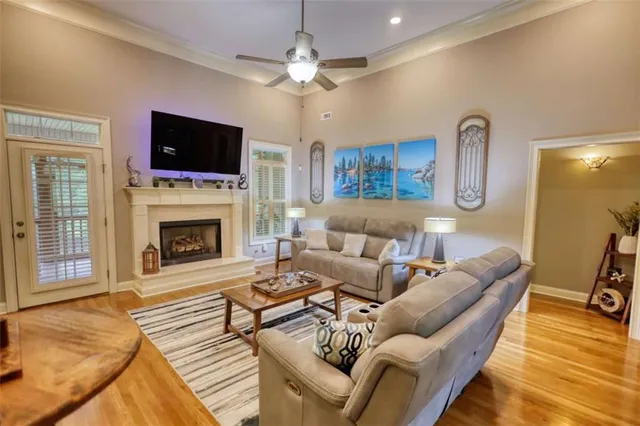 a bedroom with a bed and a flat tv screen on dresser