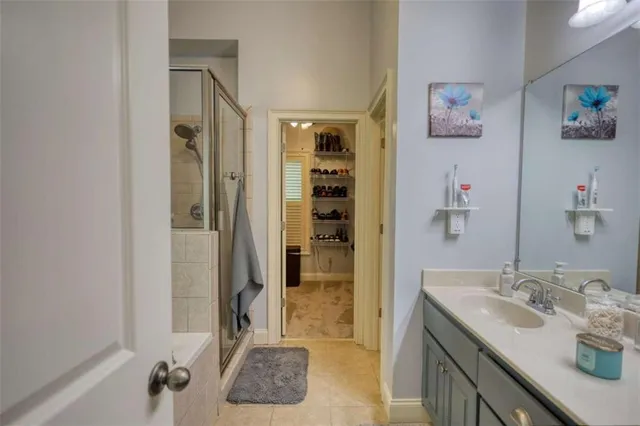 a kitchen with stainless steel appliances granite countertop a sink a stove a dining table and chairs