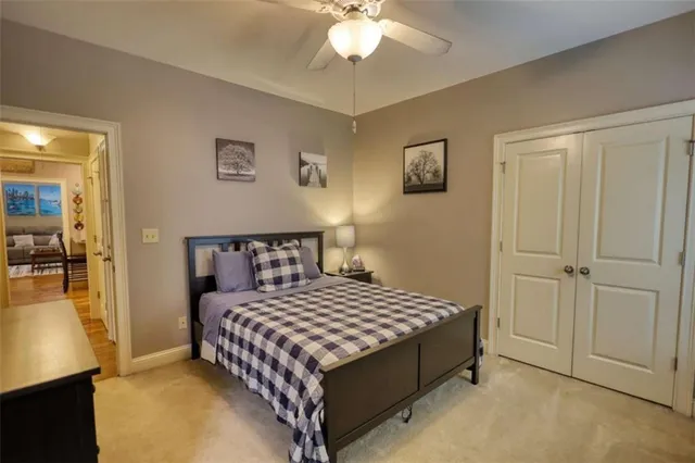 a living room with furniture flat screen tv and a chandelier