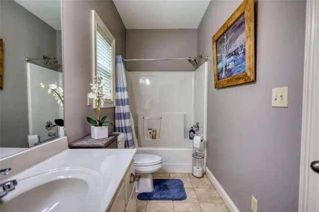 a bed room with a bed and a chandelier