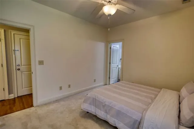 a front view of a house with a yard and outdoor seating