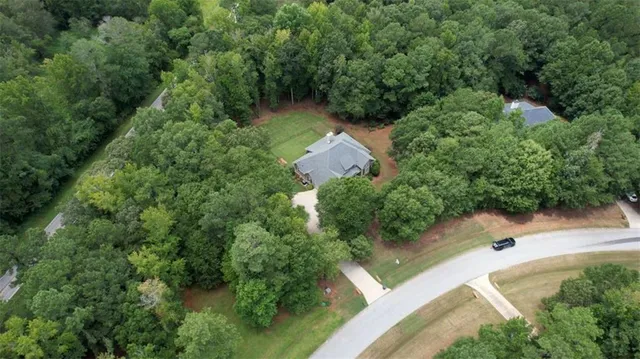 a view of a livingroom with furniture and hardwood floor