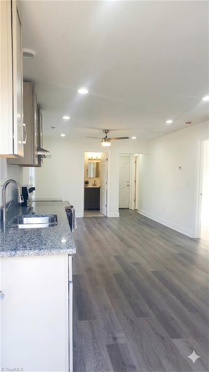 2814 Triangle Lake Road High Point, NC 27260 - Photo 6 of 13 Kitchen and living room: Used AI to enhance brightness