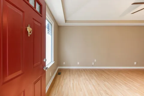 a view of a room with wooden floor and brick walls