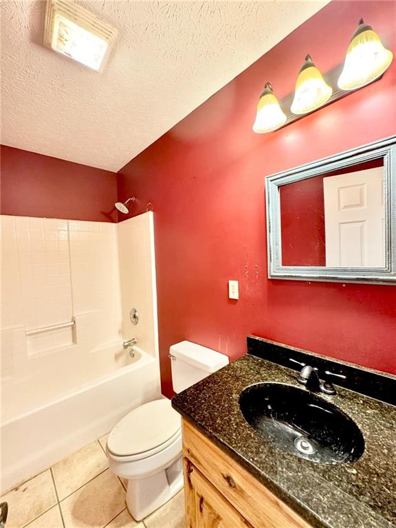 280 Owens Road Fort Mitchell, AL 36856 - Photo 27 of 56 Full bath featuring toilet, vanity, shower / bath combination, tile patterned floors, and a textured ceiling