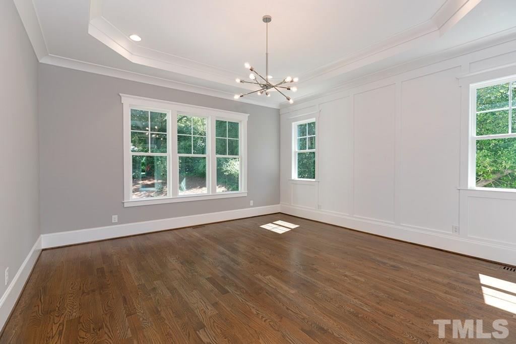 3319 Lake Boone Trail Raleigh, NC 27607 - Photo 12 of 30 a view of an empty room with wooden floor and a window