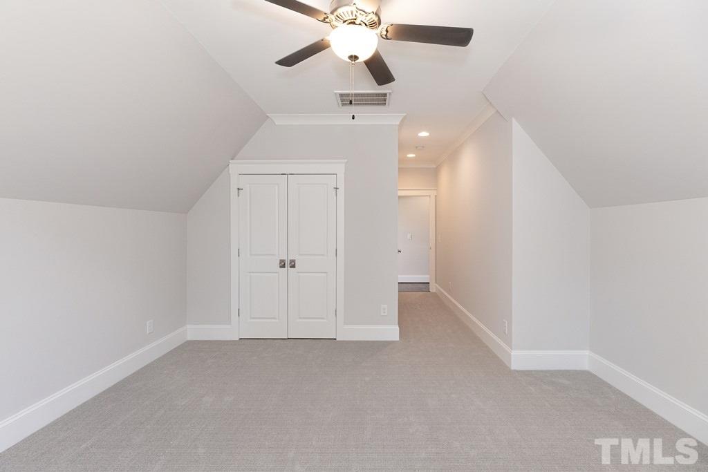 3319 Lake Boone Trail Raleigh, NC 27607 - Photo 23 of 30 an empty room with chandelier fan