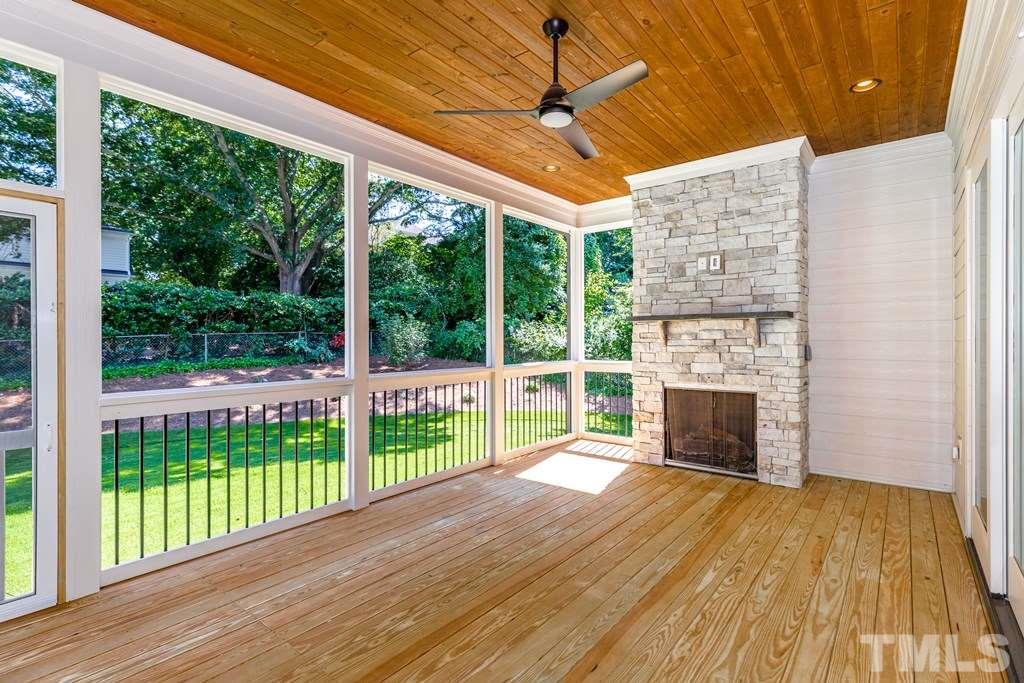3319 Lake Boone Trail Raleigh, NC 27607 - Photo 27 of 30 a view of empty room with wooden floor and fireplace