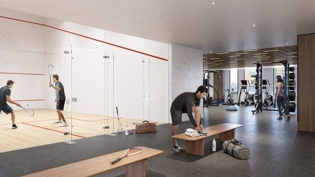 a living room with furniture and gym equipment