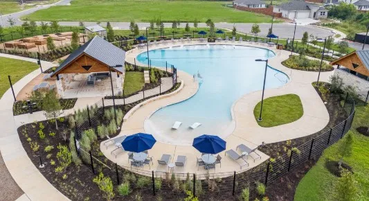 a view of a swimming pool and an outdoor seating