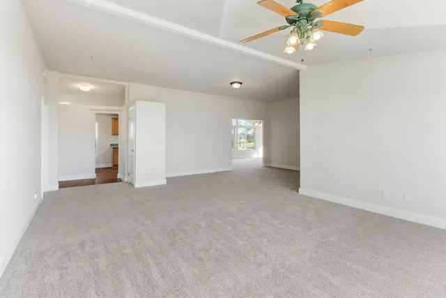 a kitchen with a sink a counter top space stainless steel appliances and cabinets