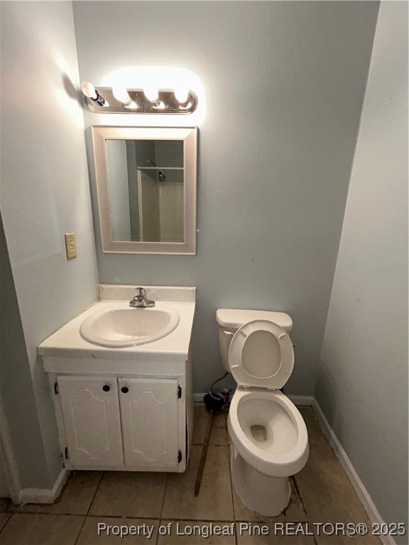 6320 Marykirk Drive, Unit C Fayetteville, NC 28304 - Photo 12 of 14 a bathroom with a toilet sink and mirror