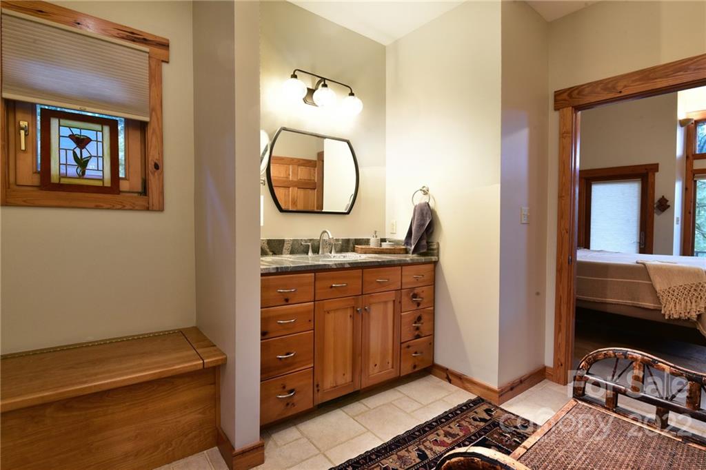 175 Clearview Point Drive Mount Gilead, NC 27306 - Photo 24 of 48 a bathroom with a sink and a mirror