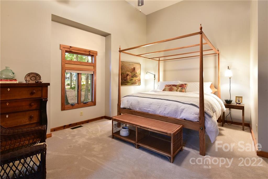 175 Clearview Point Drive Mount Gilead, NC 27306 - Photo 26 of 48 a bedroom with a bed and a dresser next to a window