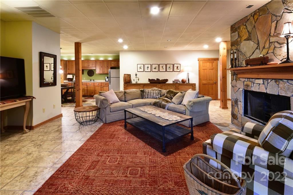 175 Clearview Point Drive Mount Gilead, NC 27306 - Photo 29 of 48 a living room with furniture fireplace and rug