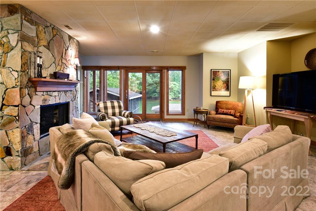 175 Clearview Point Drive Mount Gilead, NC 27306 - Photo 30 of 48 a living room with furniture fireplace and a flat screen tv