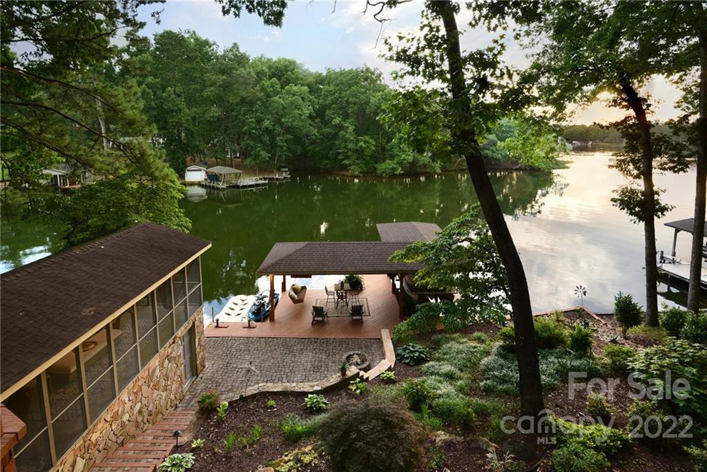 175 Clearview Point Drive Mount Gilead, NC 27306 - Photo 3 of 48 a view of a wooden deck and lake