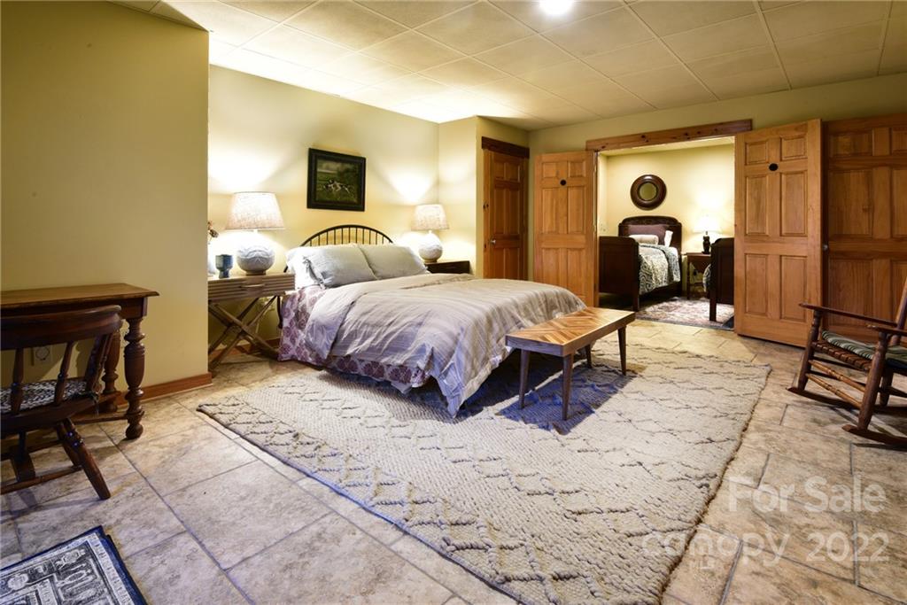 175 Clearview Point Drive Mount Gilead, NC 27306 - Photo 33 of 48 a spacious bedroom with a bed and a desk