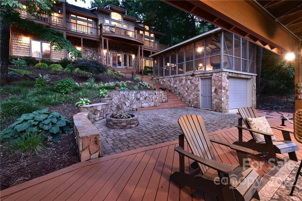 175 Clearview Point Drive Mount Gilead, NC 27306 - Photo 42 of 48 a view of a chair and table in backyard of the house