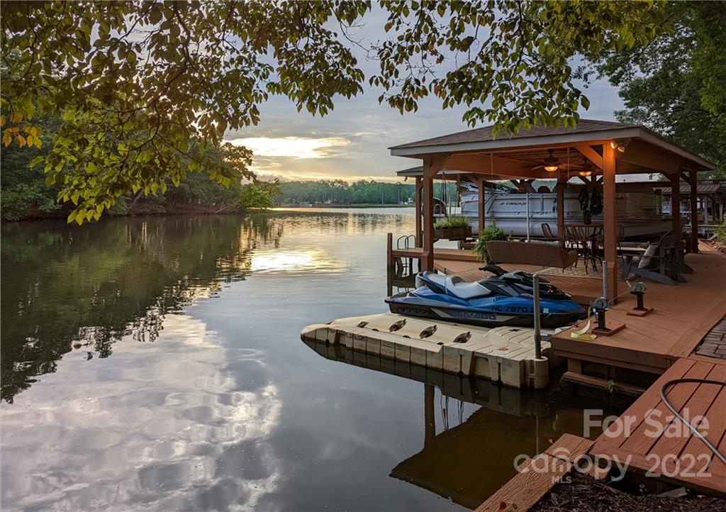 175 Clearview Point Drive Mount Gilead, NC 27306 - Photo 47 of 48 a backyard of a house with wooden floor and lake view
