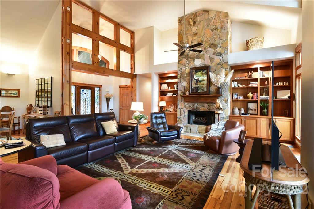 175 Clearview Point Drive Mount Gilead, NC 27306 - Photo 8 of 48 a living room with furniture fireplace and a large window