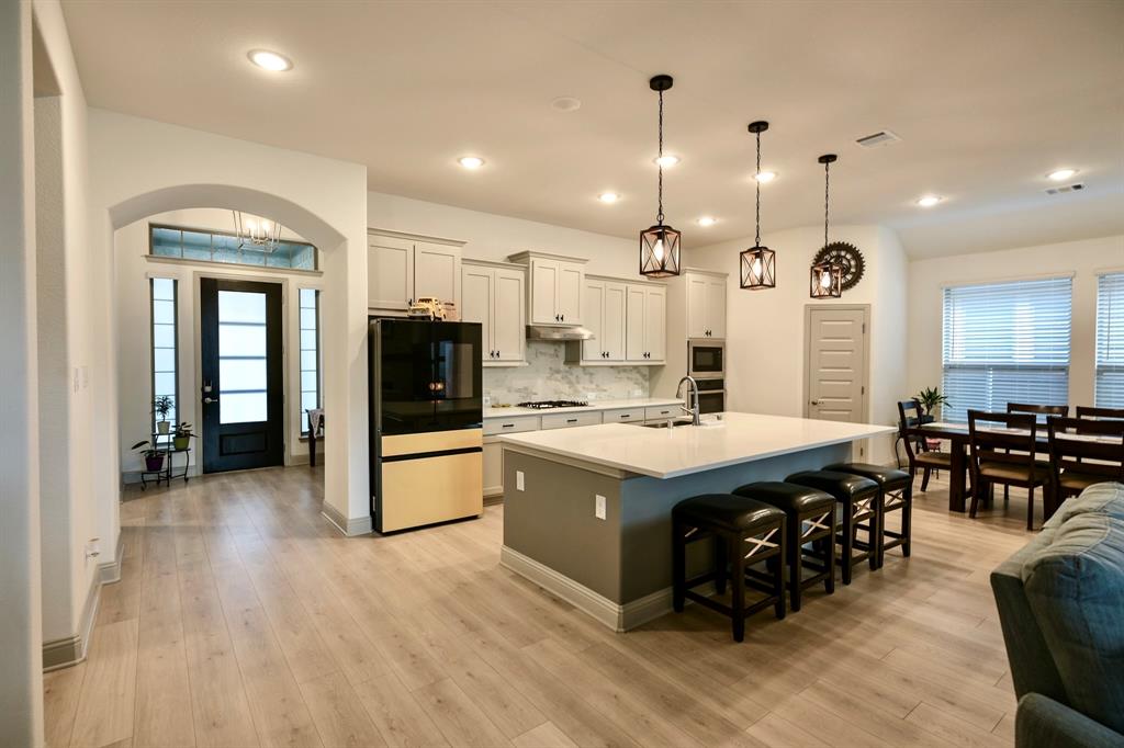 2609 Henley Way Venus, TX 76084 - Photo 13 of 40 a large kitchen with lots of counter space a sink appliances and cabinets