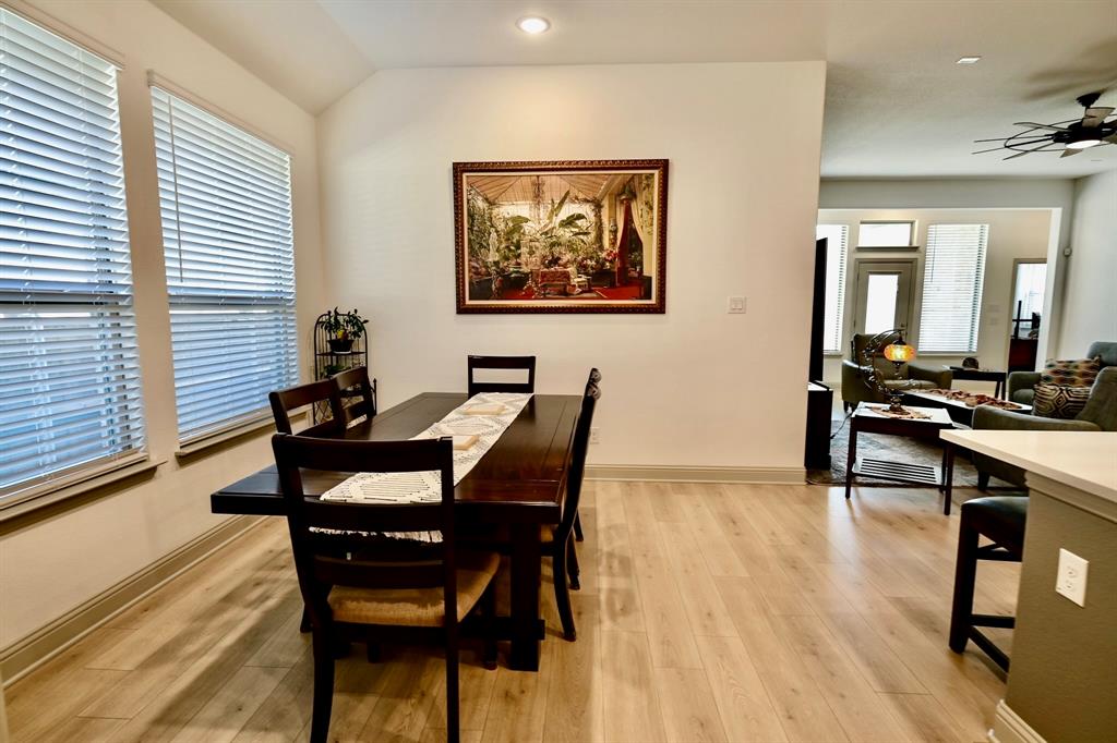2609 Henley Way Venus, TX 76084 - Photo 16 of 40 a dining room with furniture and wooden floor