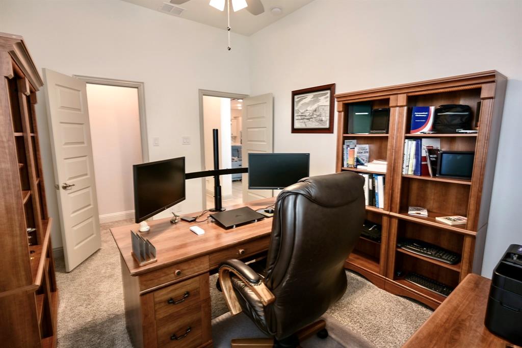 2609 Henley Way Venus, TX 76084 - Photo 33 of 40 a view of a workspace with furniture and a bookshelf