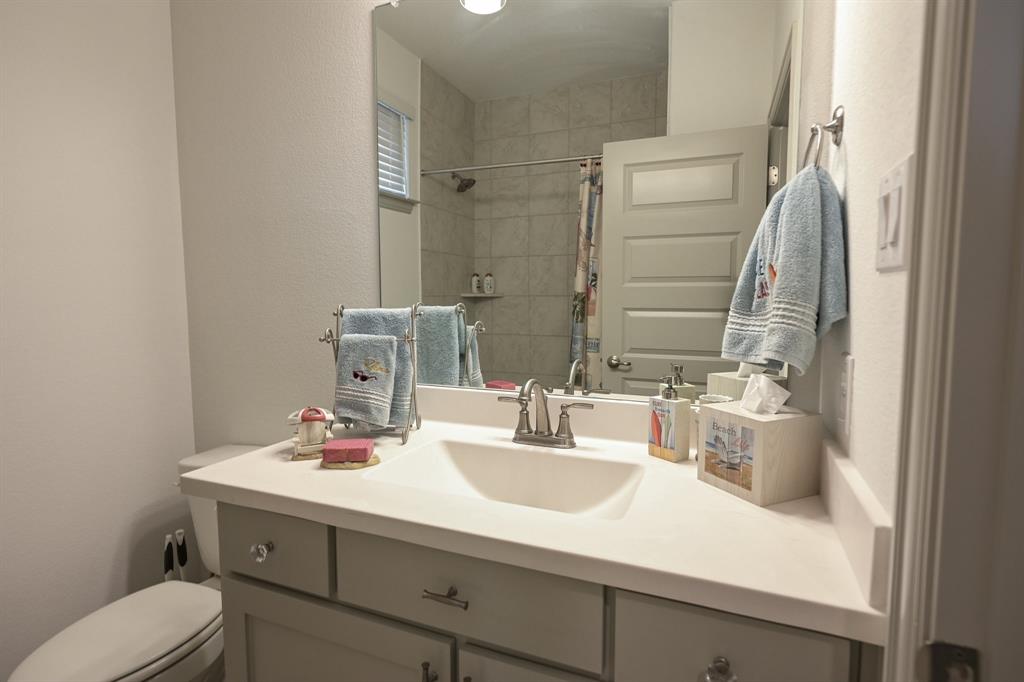 2609 Henley Way Venus, TX 76084 - Photo 34 of 40 a bathroom with a sink and a mirror