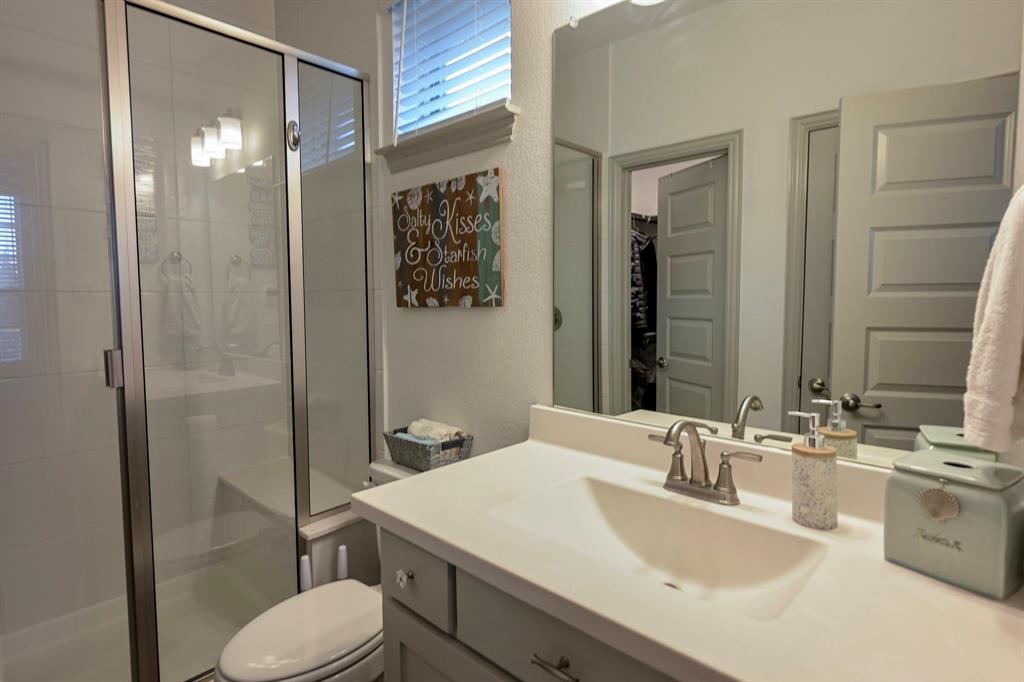 2609 Henley Way Venus, TX 76084 - Photo 10 of 40 a bathroom with a sink toilet and shower