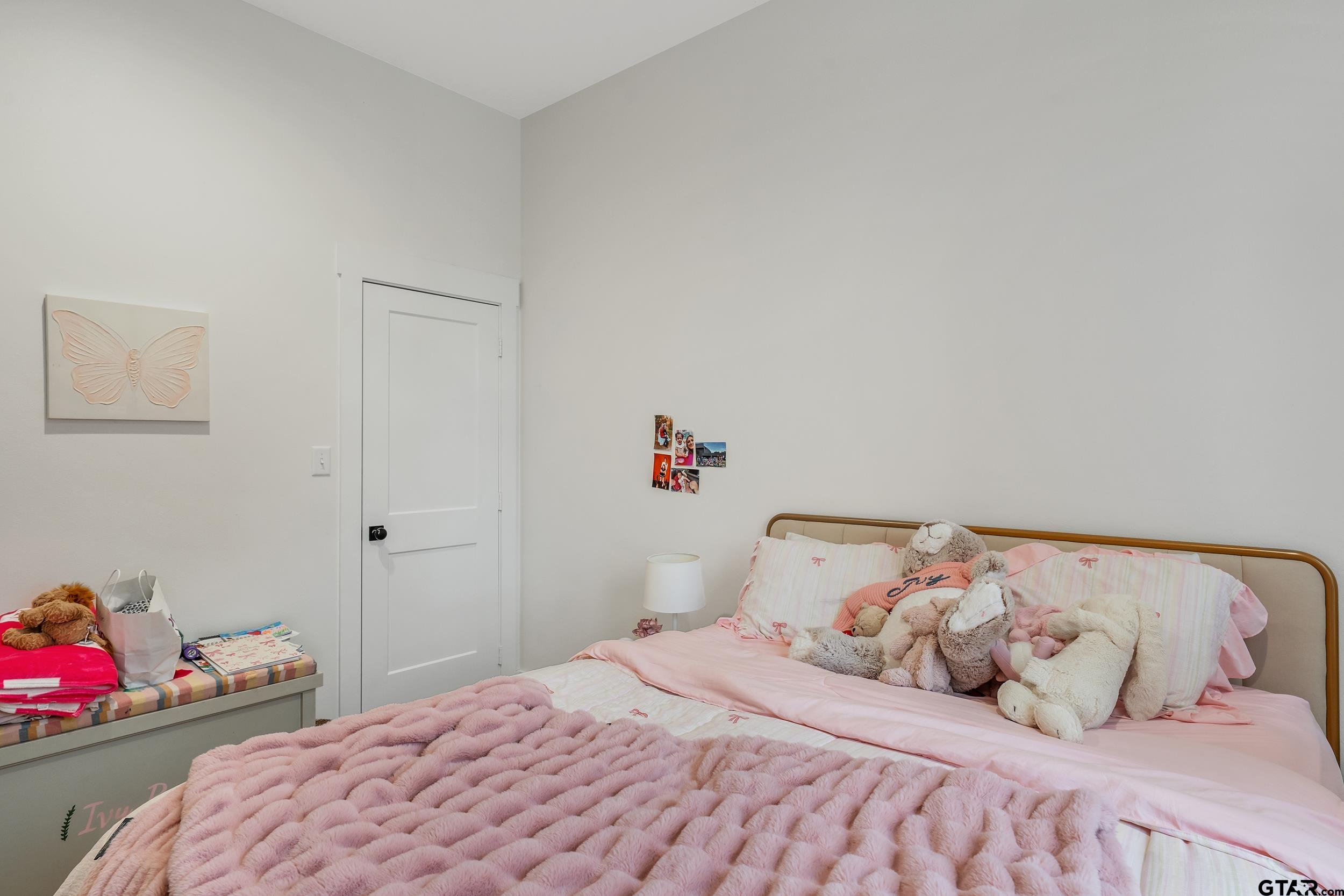 16837 Wilson Road Tyler, TX 75707 - Photo 33 of 44 a bedroom with a bed and a dresser