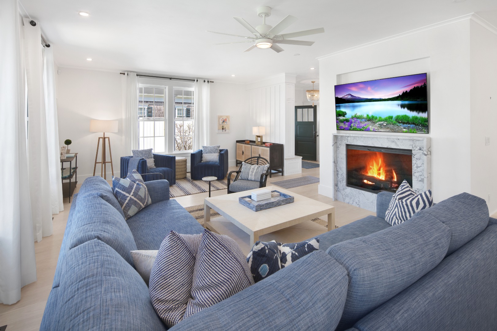 95 School Street Edgartown, MA 02539 - Photo 13 of 57 a living room with furniture and a fireplace