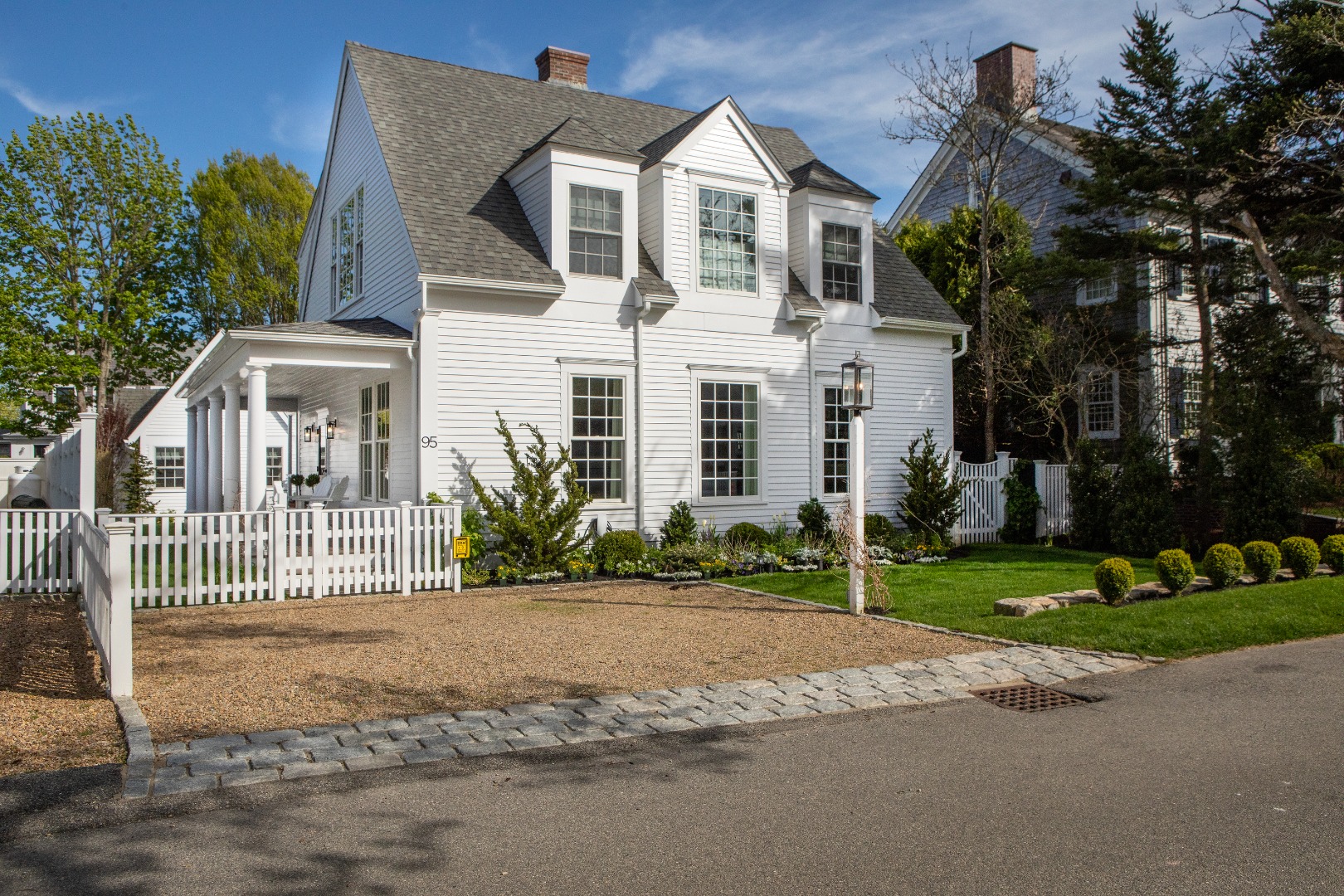 95 School Street Edgartown, MA 02539 - Photo 2 of 57 a front view of a house with a garden