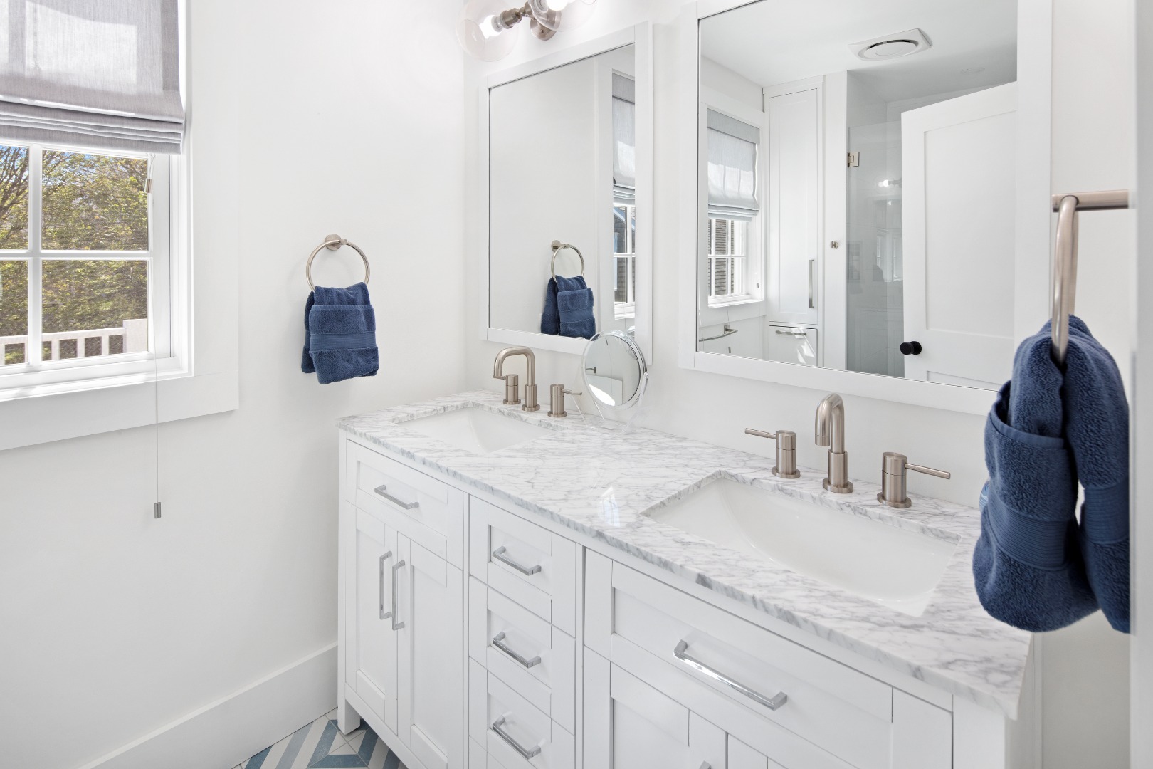 95 School Street Edgartown, MA 02539 - Photo 23 of 57 a bathroom with a granite countertop sink and a mirror