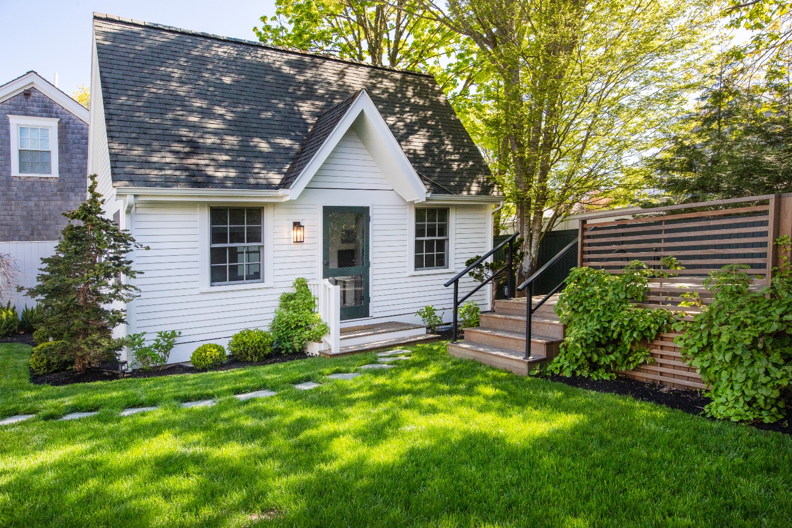 95 School Street Edgartown, MA 02539 - Photo 37 of 57 a front view of house with a garden