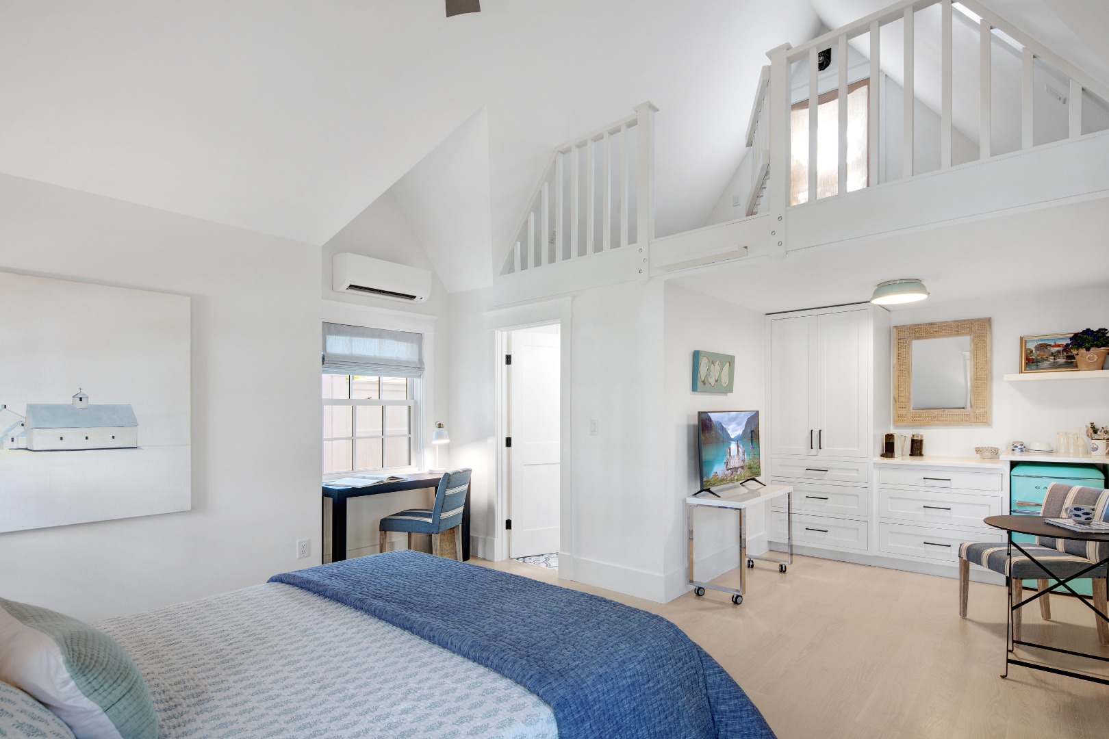 95 School Street Edgartown, MA 02539 - Photo 41 of 57 a bedroom with a bed a desk and chair