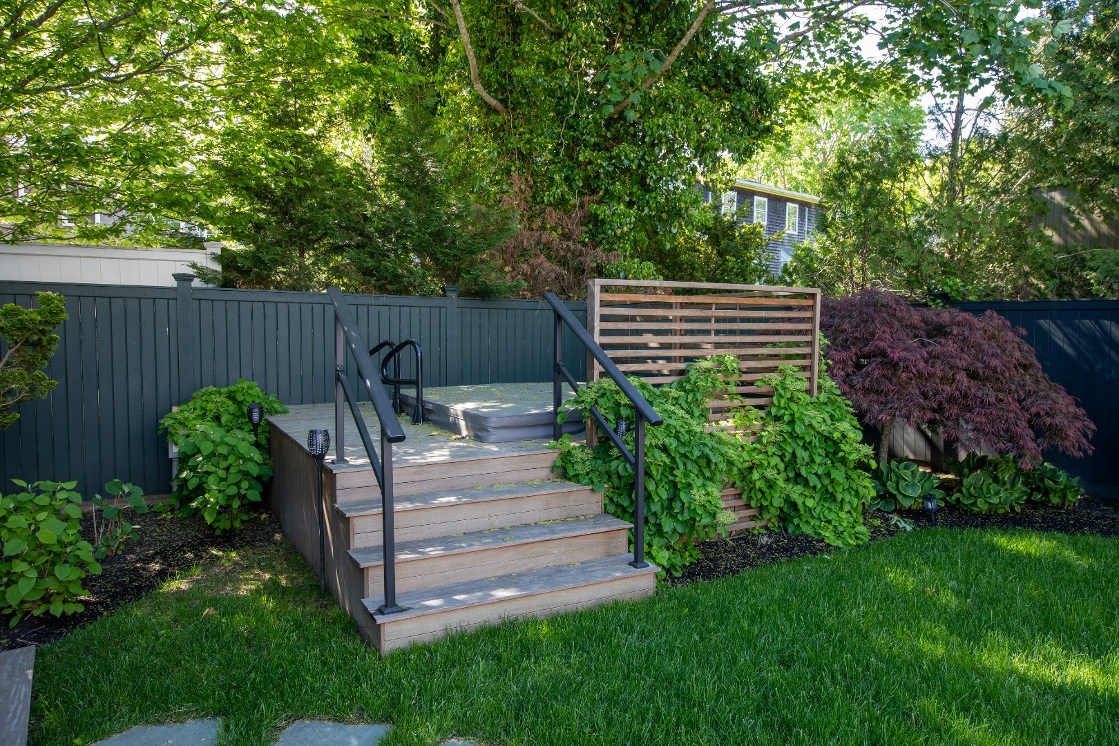 95 School Street Edgartown, MA 02539 - Photo 53 of 57 a view of a backyard with plants